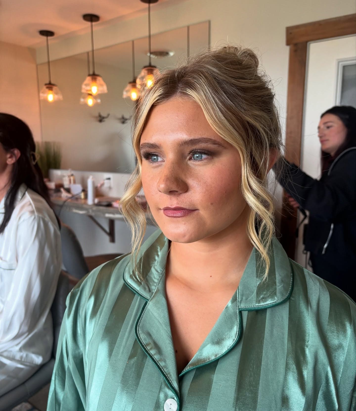 Bride having her hair and makeup finished before the ceremony