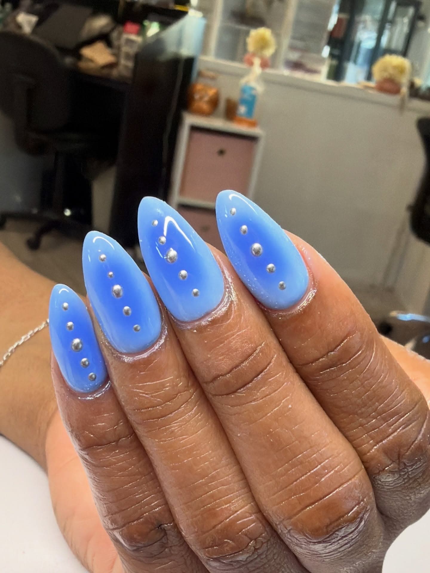 Minimalist blue nail set with silver studs