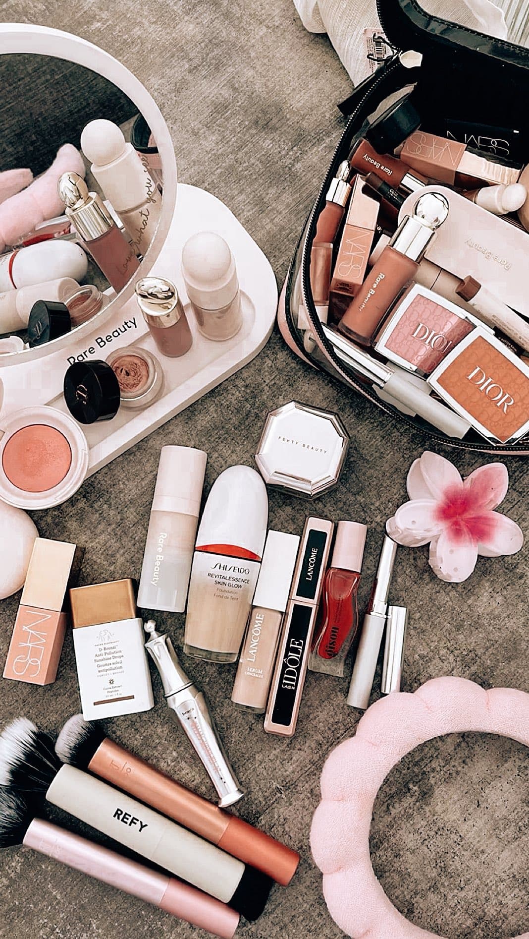 Flat-lay of professional makeup products used for client applications